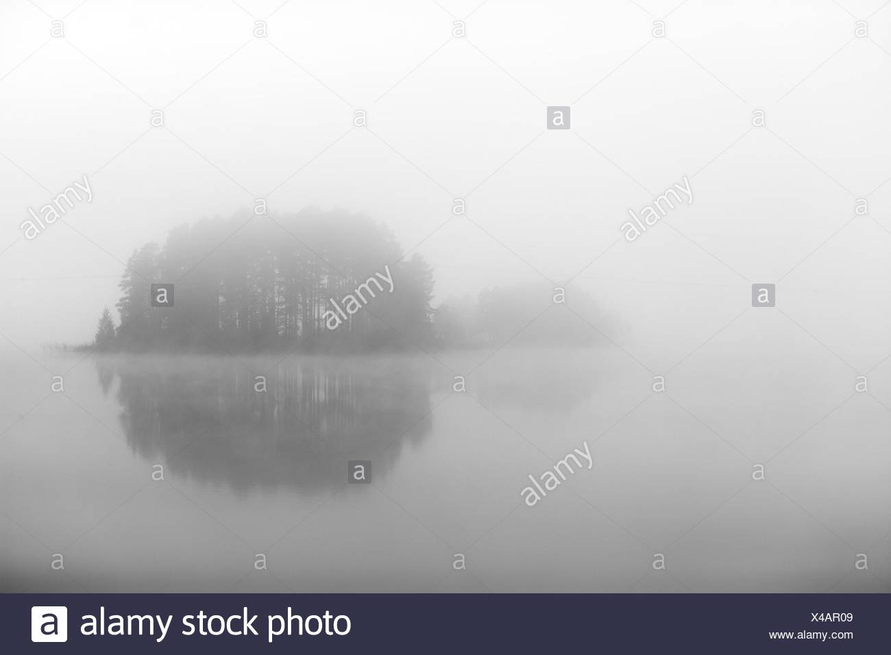An Island Shrouded In Fog Sweden Stock Photo Alamy