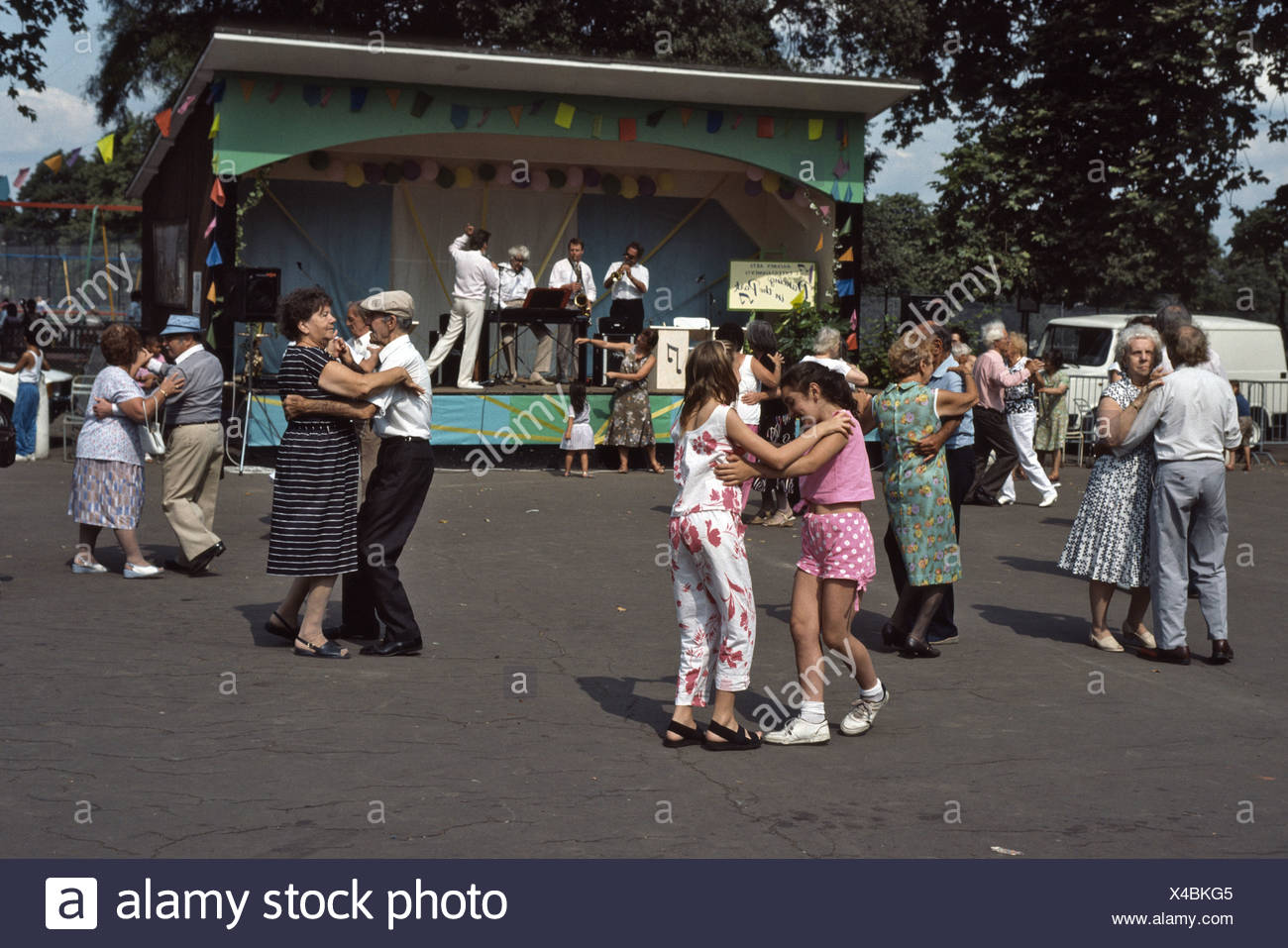 Outdoor Tea Dance In The Park With Old Couples And Young Girls Dancing Stock Photo Alamy