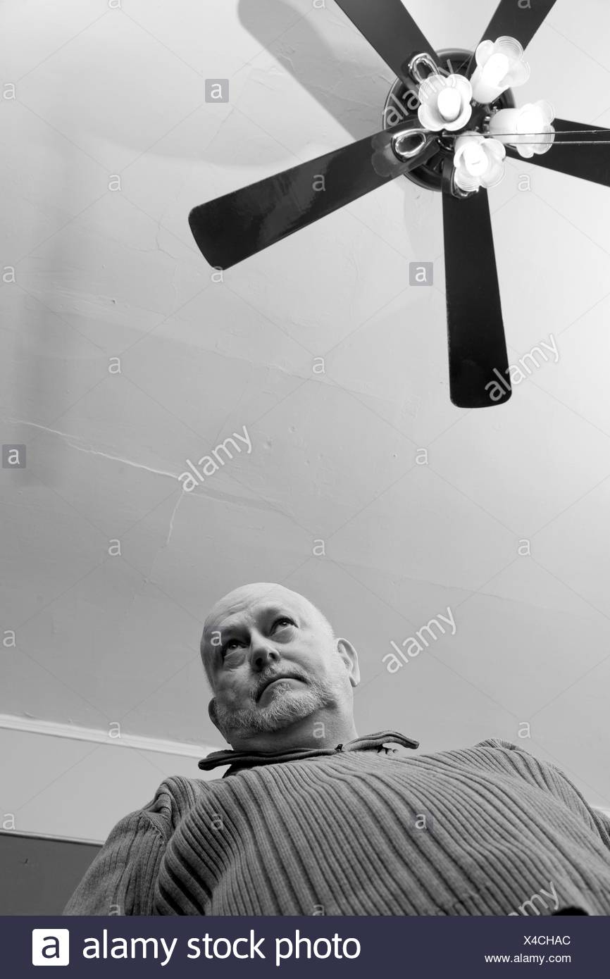 Older Man Standing Under A Ceiling Fan Stock Photo 278101556 Alamy