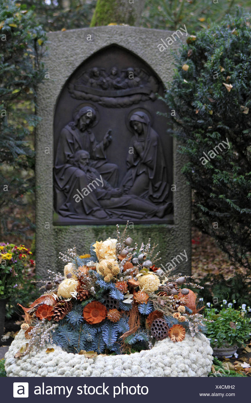 Geschmuecktes Grab auf einem Friedhof an Allerheiligen Stock Photo