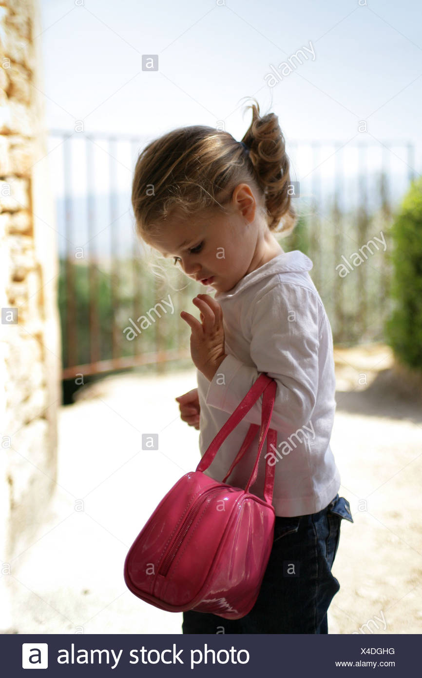 girl holding purse