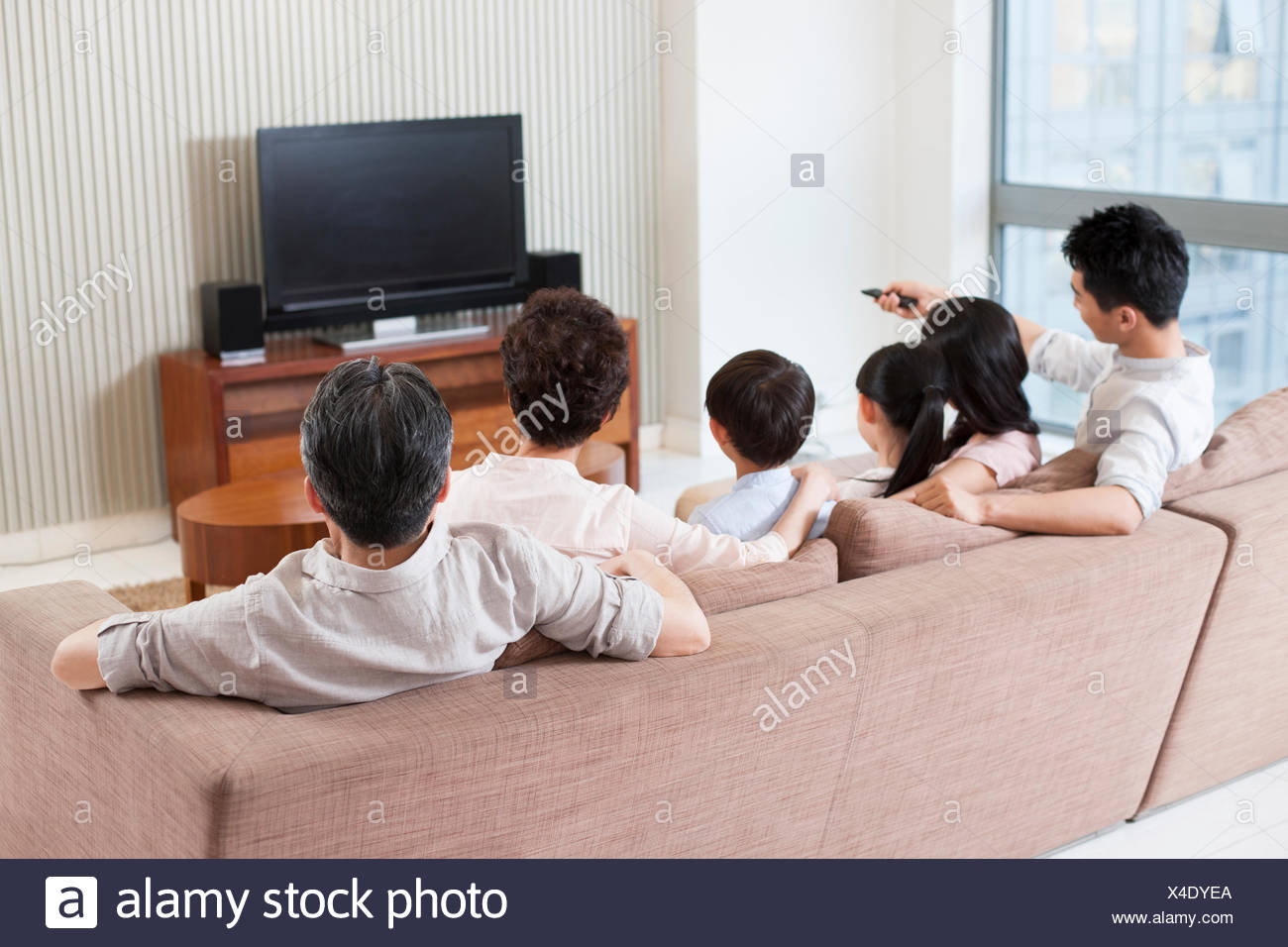 Big Family Watching Tv In Living Room Stock Photo Alamy Big Family Watching Tv In Living Room Stock Photo Alamy
