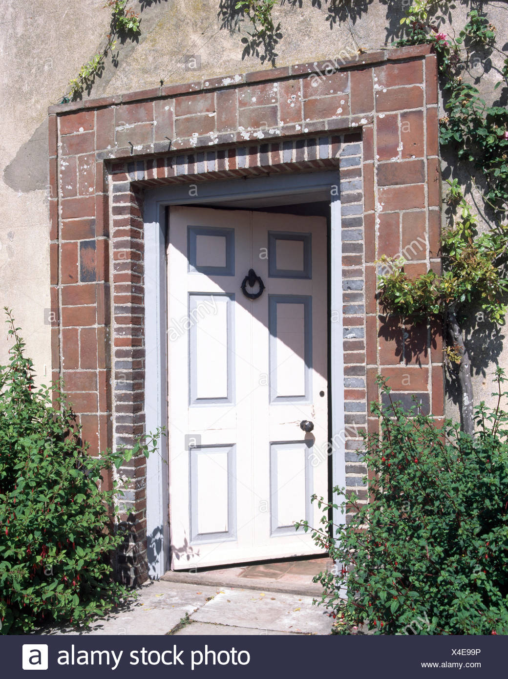 Close Up Of A White Painted Front Door Of A Sussex Farmhouse