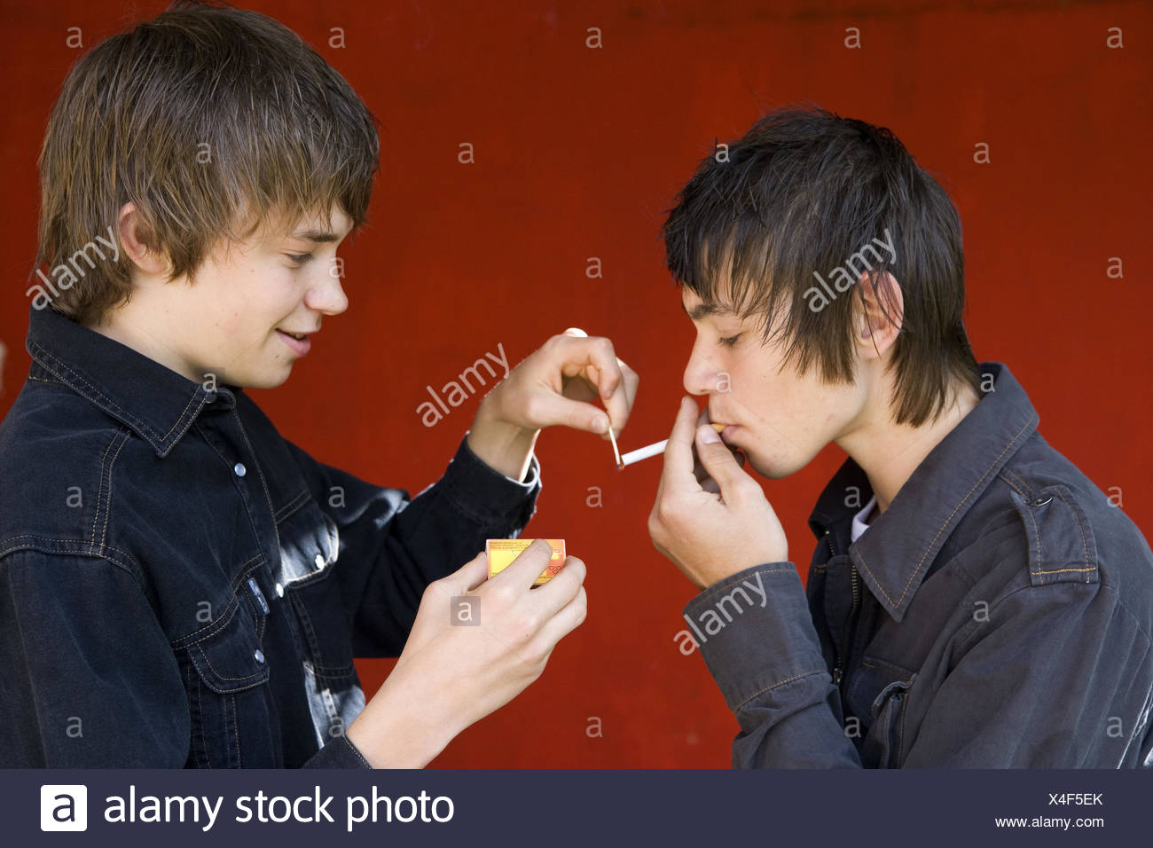 Teenagersboyscigarette smoke stock image
