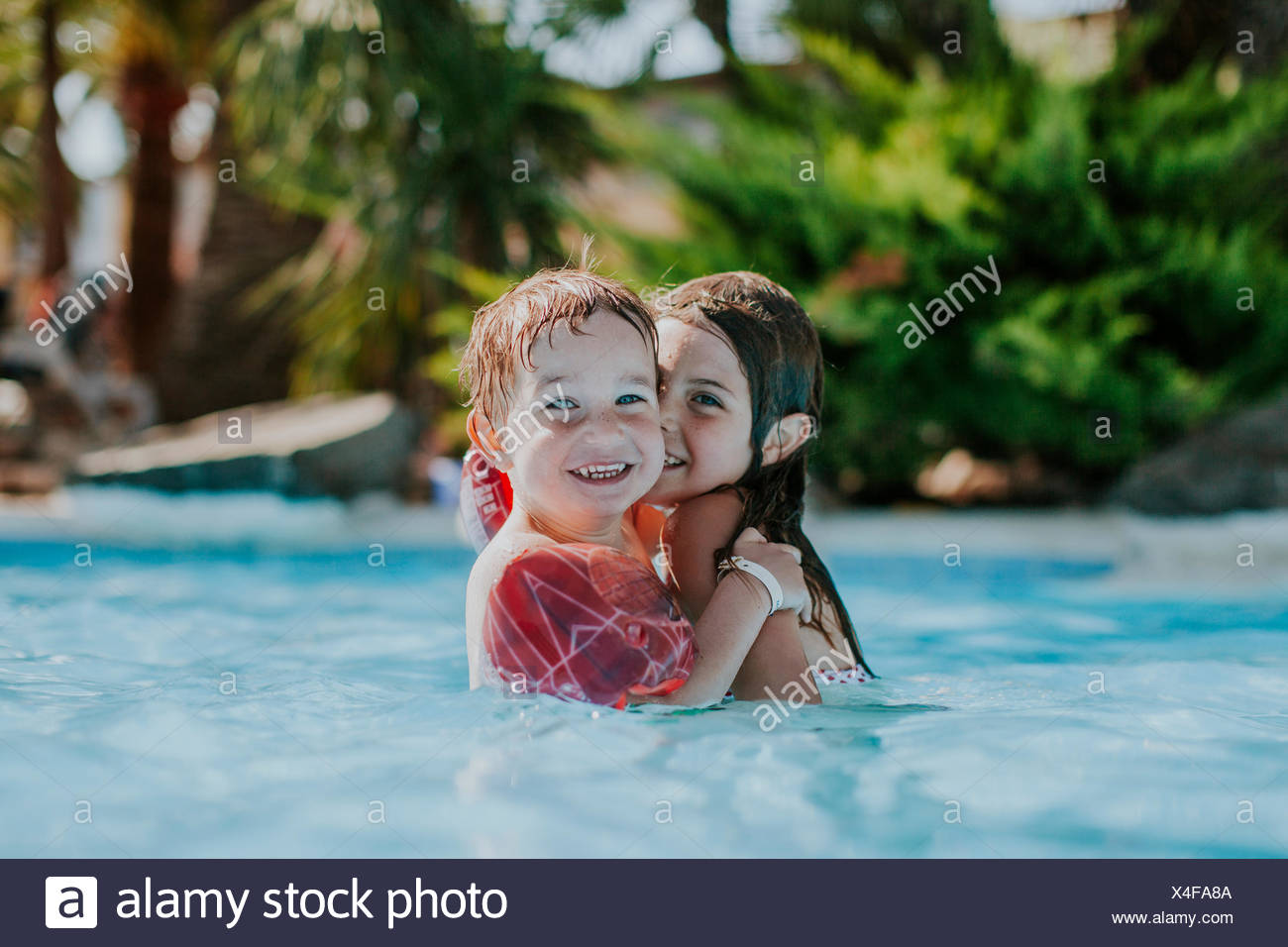 Young Boys In Swimming Pool High Resolution Stock Photography and