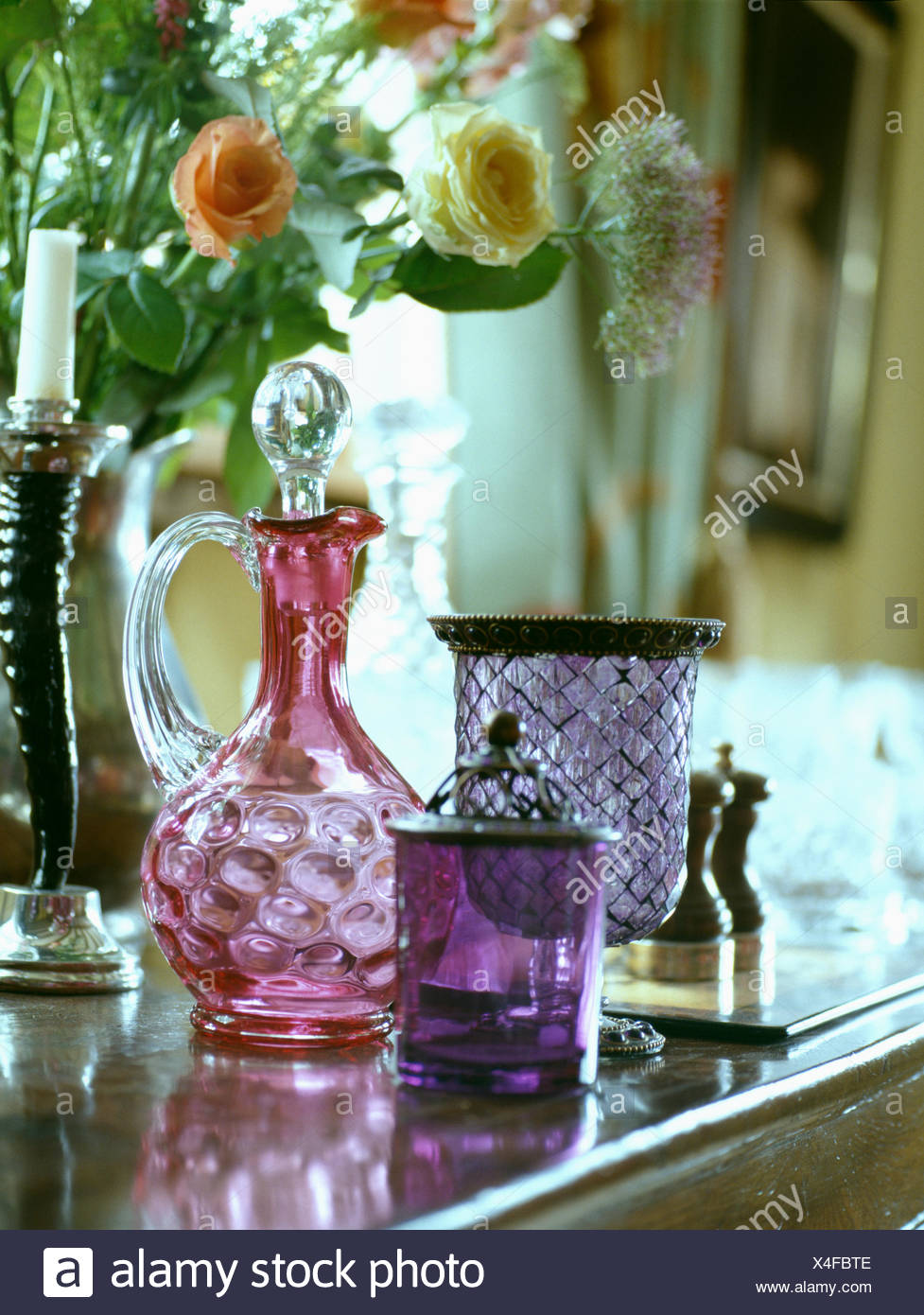 Still Life Of Antique Cranberry Glass Decanter With Purple And