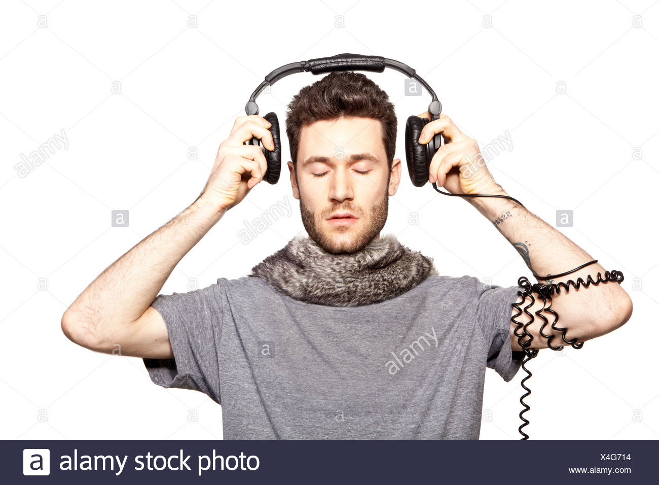 pix Guy With Headphones Stock Photo https www alamy com young man putting on headphones image278181264 html