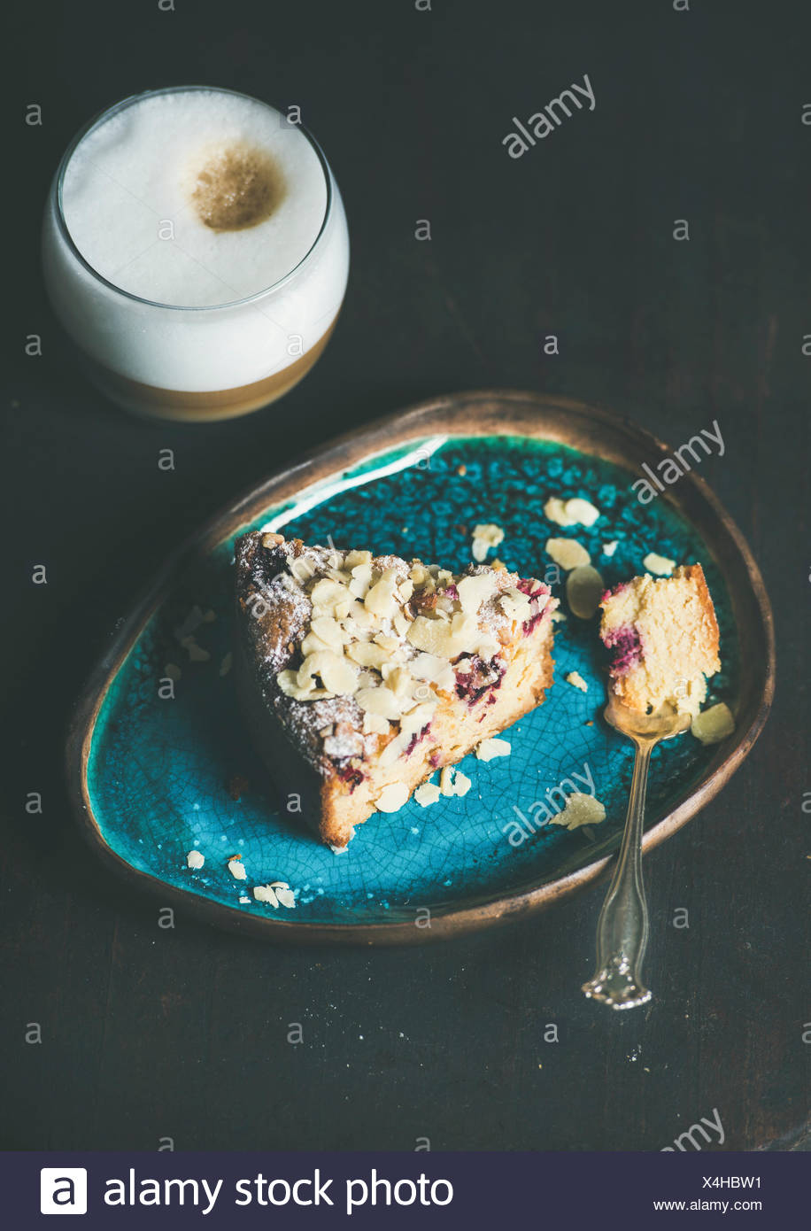 Dessert And Coffee Piece Of Lemon Ricotta Almond And Raspberry Gluten Free Cake And Glass Of Latte Over Dark Wooden Background Selective Focus Co Stock Photo Alamy