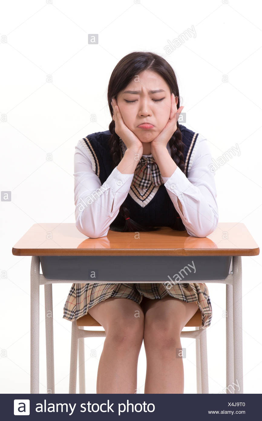 Stressful High School Girl Sitting At Desk Stock Photo 278227376