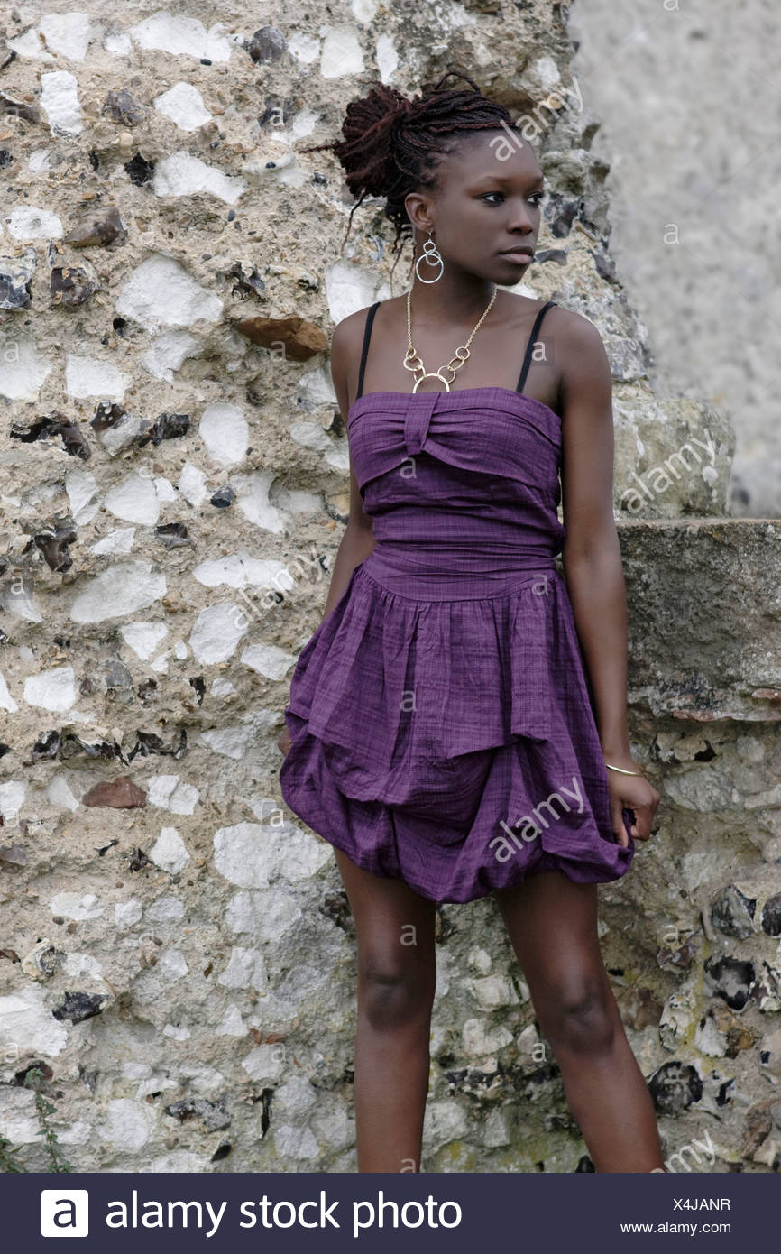 Female Brunette Afro Hair In Hair Updo Wearing A Short Purple