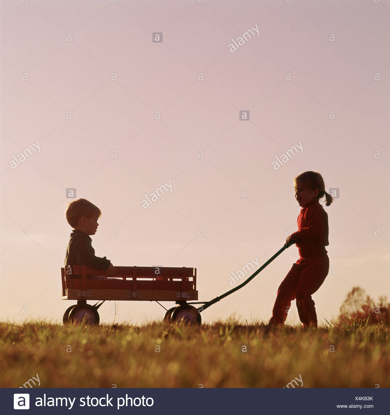 girl pulling wagon