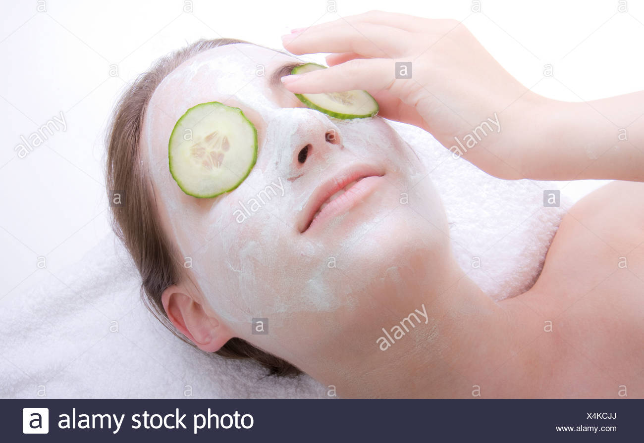 Download Young Woman With Cucumber Face Mask Stock Photo Alamy PSD Mockup Templates