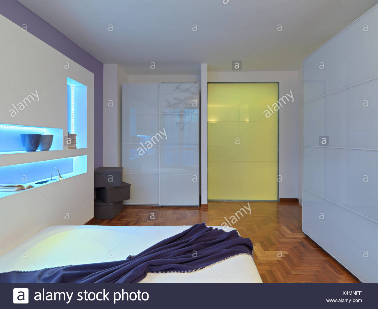Interior View Of A Modern Bedroom With Glass Wardrobe And