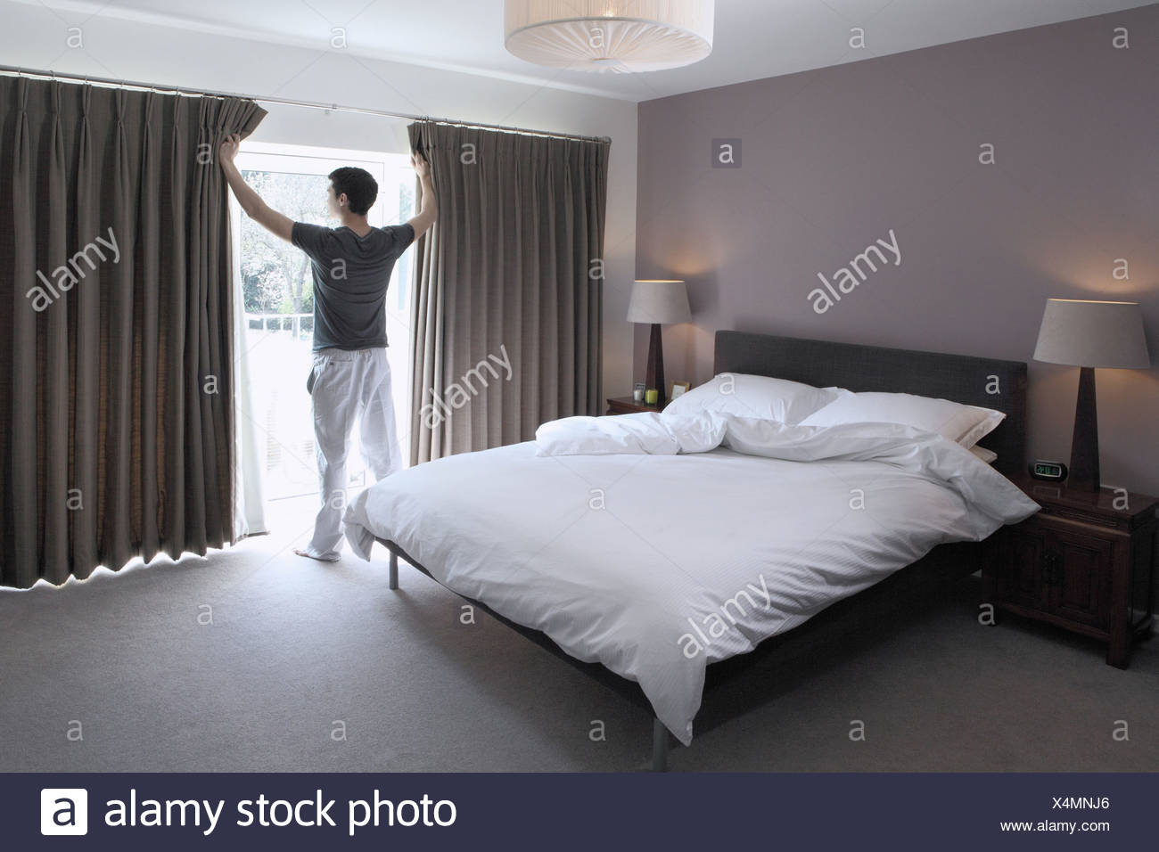 Man Looking Through Glass Door Of Bedroom Stock Photo 278280526 Alamy Man Looking Through Glass Door Of Bedroom
