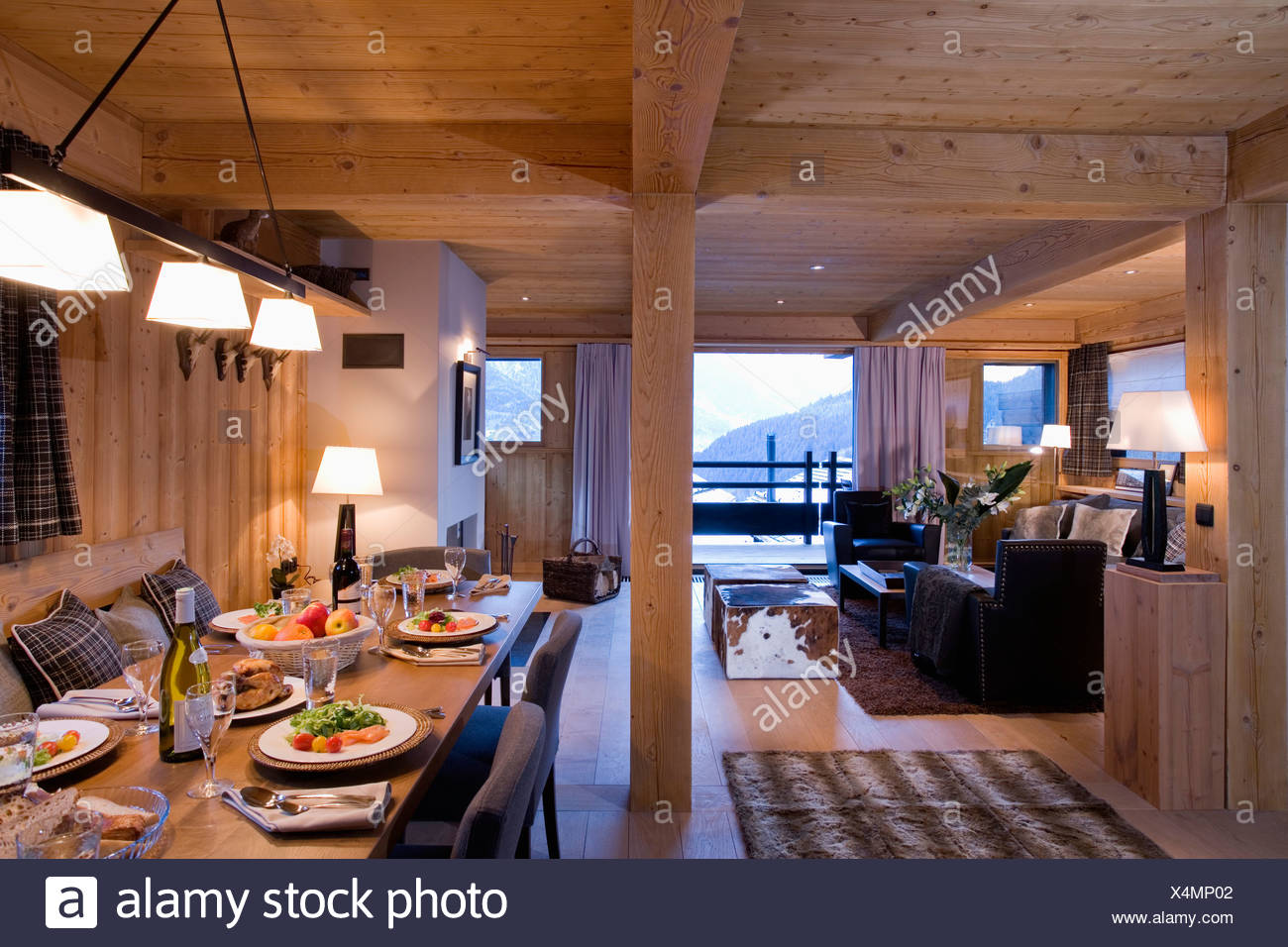 Pendant Lighting Over Table With Place Settings Food In