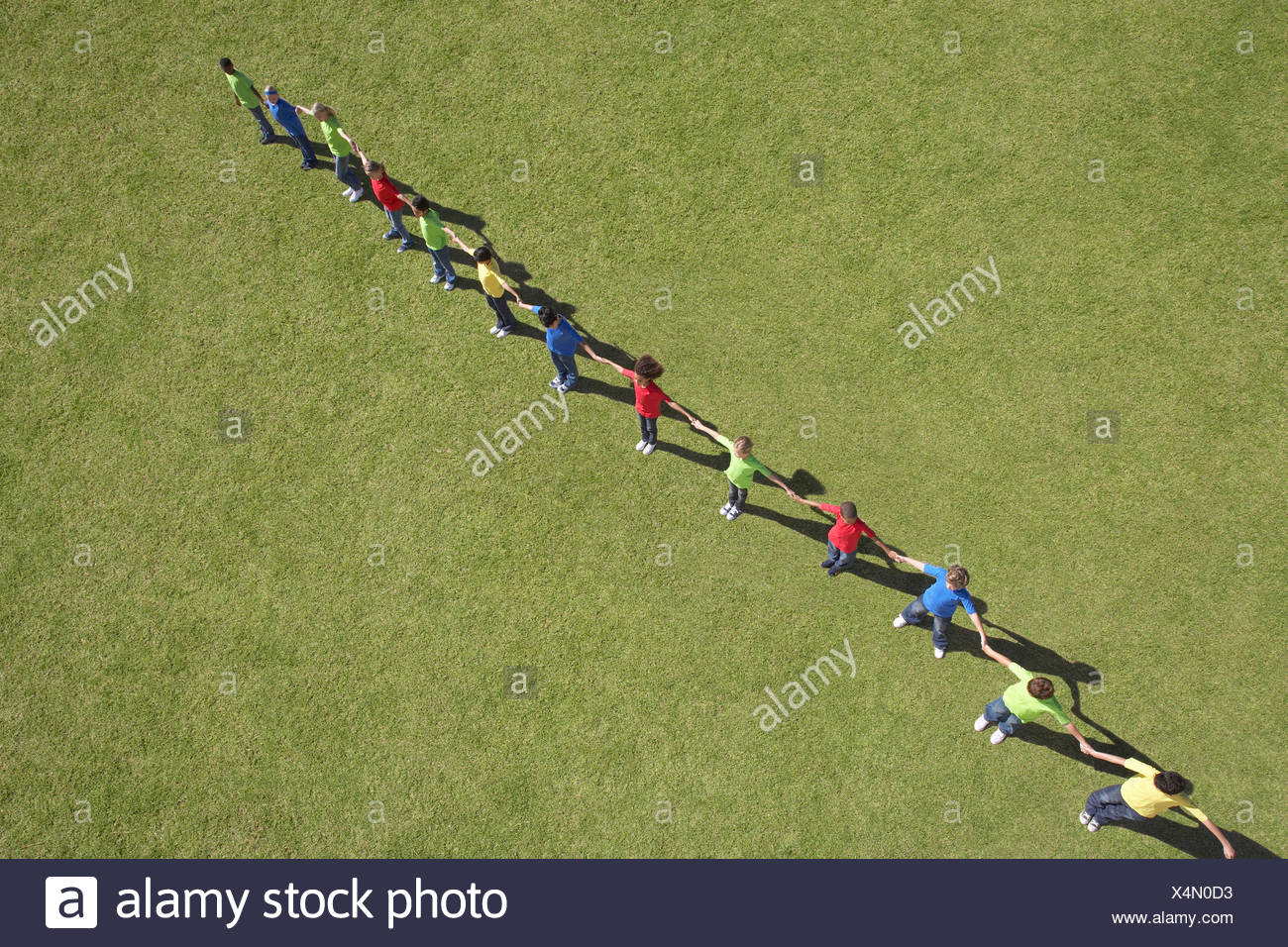Line Of People Holding Hands Stock Photos & Line Of People Holding