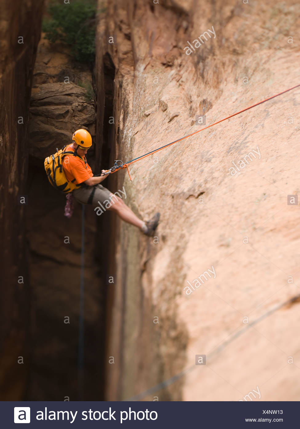 Man In Rappelling Gear At Top Of Cliff Stock Photo 278305135 Alamy