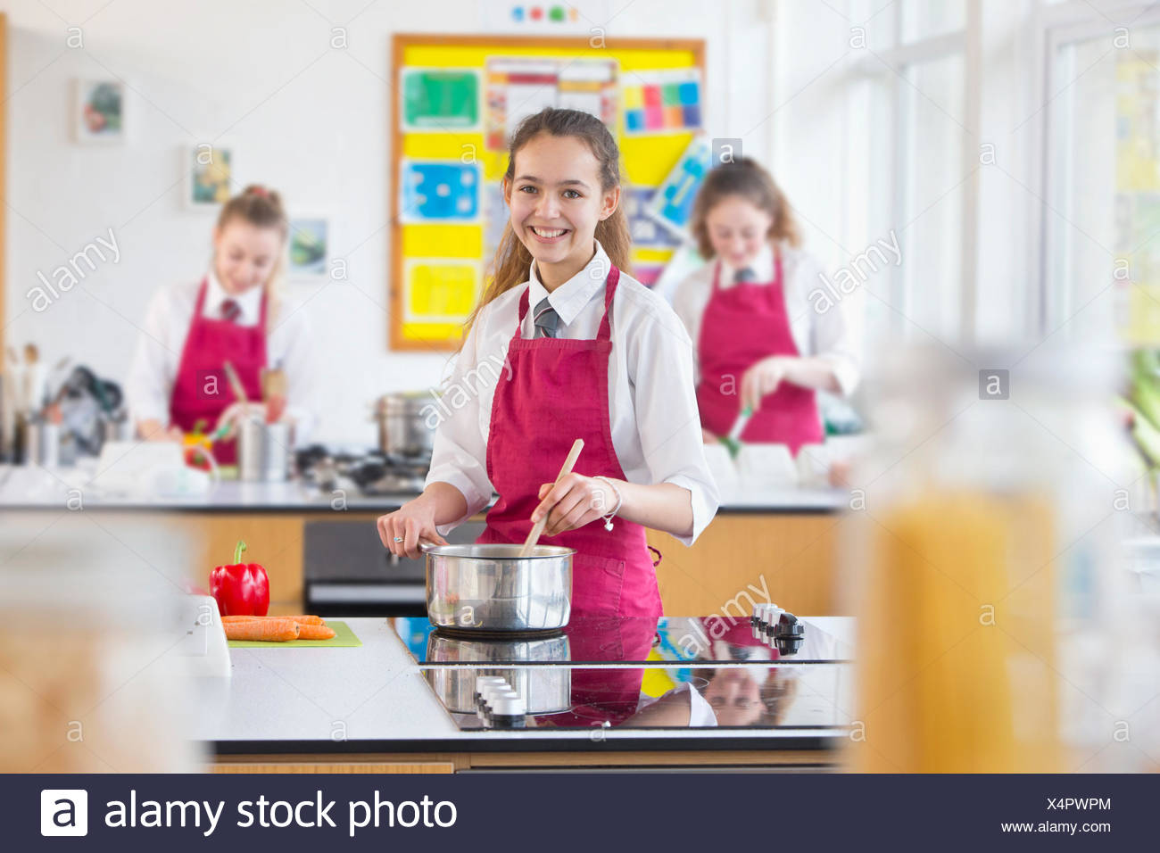 Portrait Confident High School Student Cooking In Home Economics