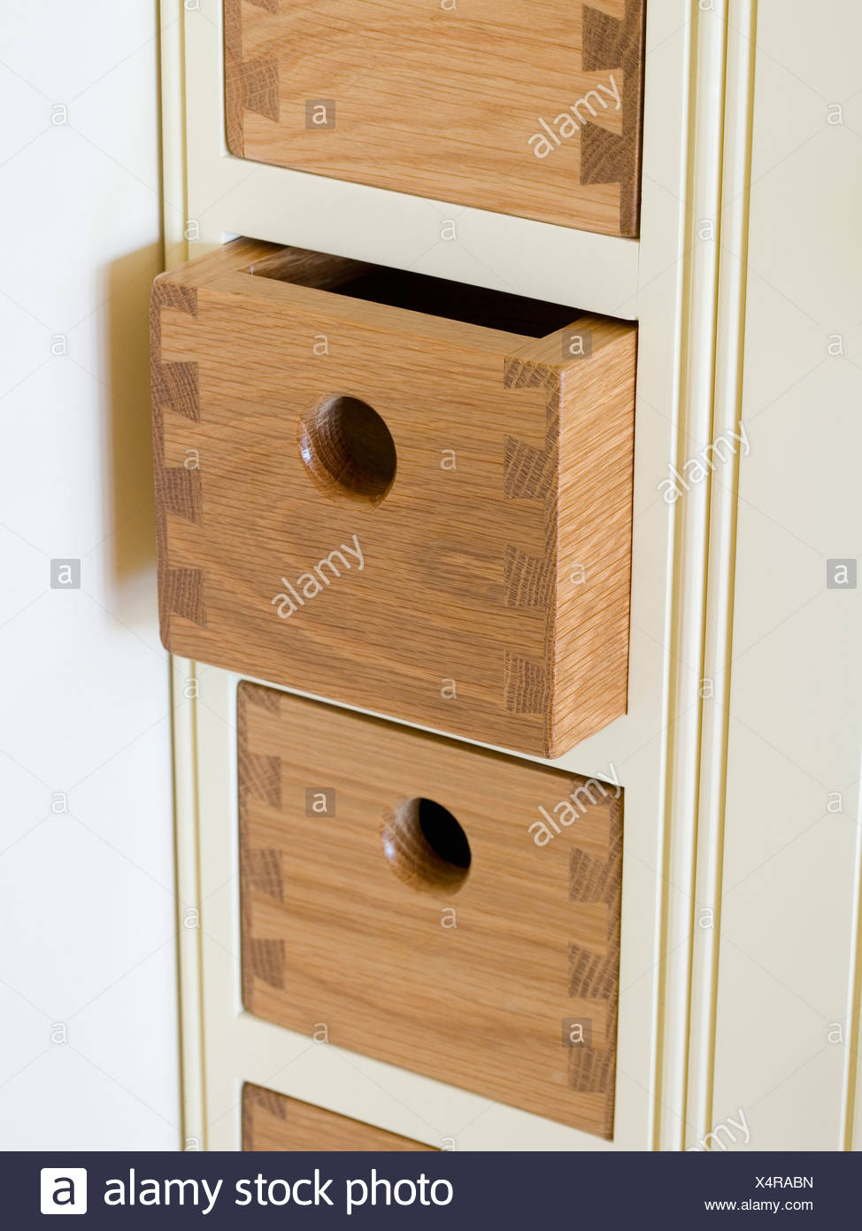 Close Up Of Small Wood Drawers In Narrow Fitted Kitchen Unit Stock