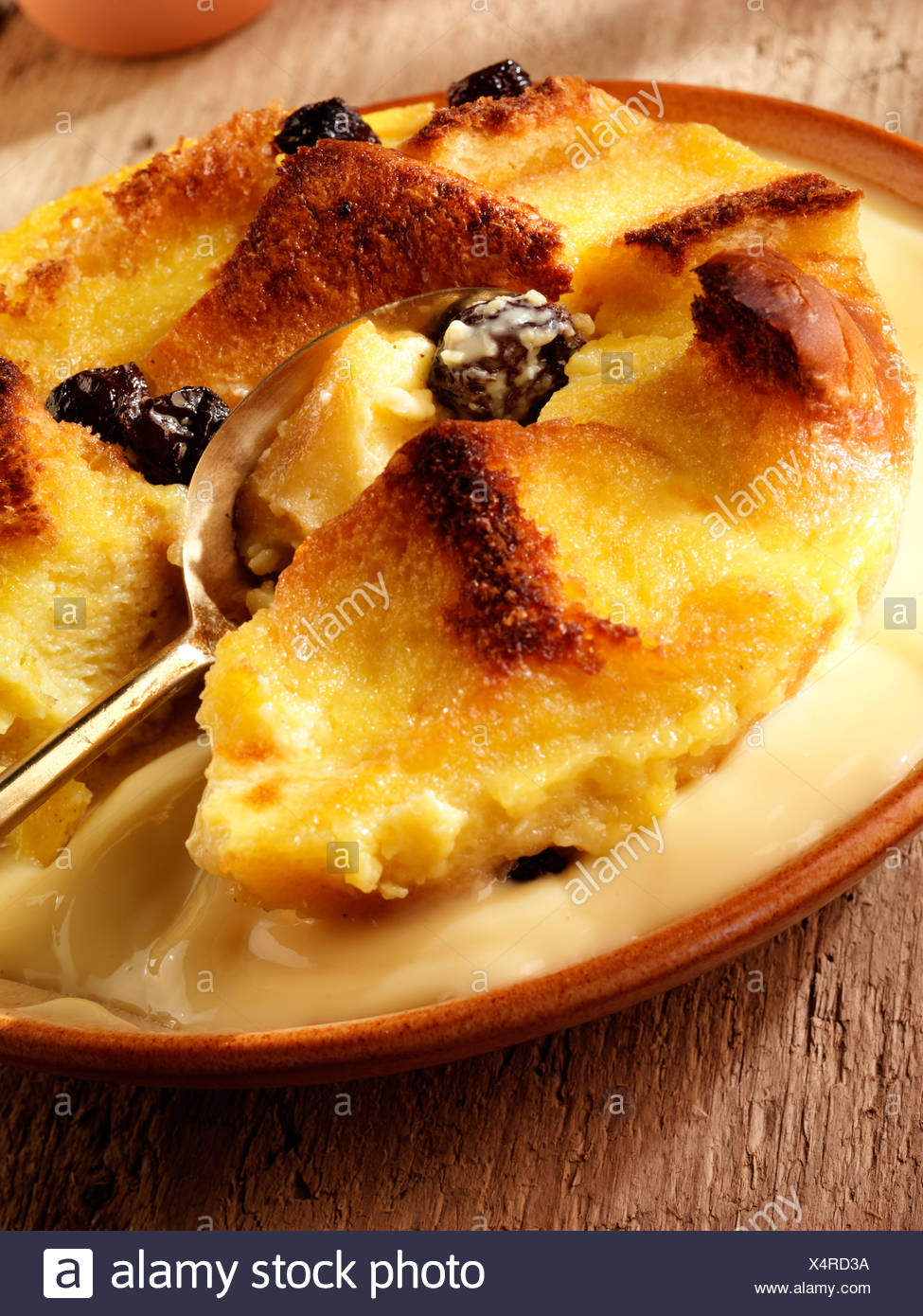 Bread And Butter Pudding With Custard Stock Photo Alamy