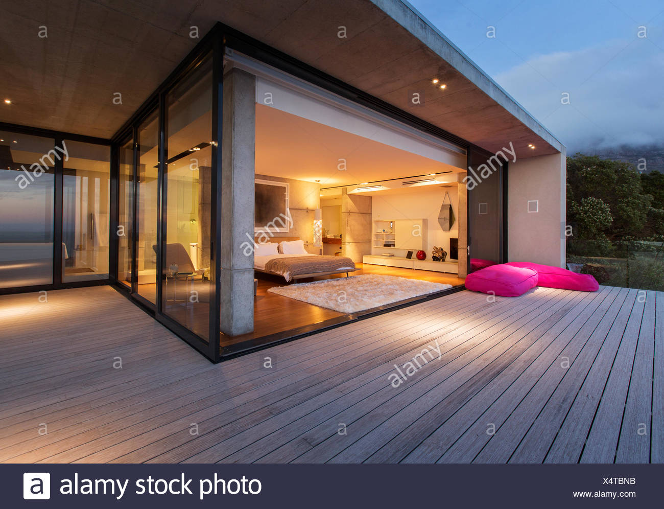 Sliding Glass Doors Onto Bedroom Of Modern House Stock Photo