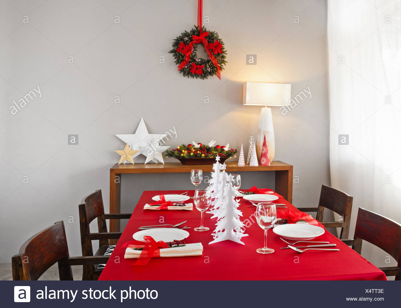 Christmas Dinner Table Setup With Decoration On The Side Board Stock Photo Alamy