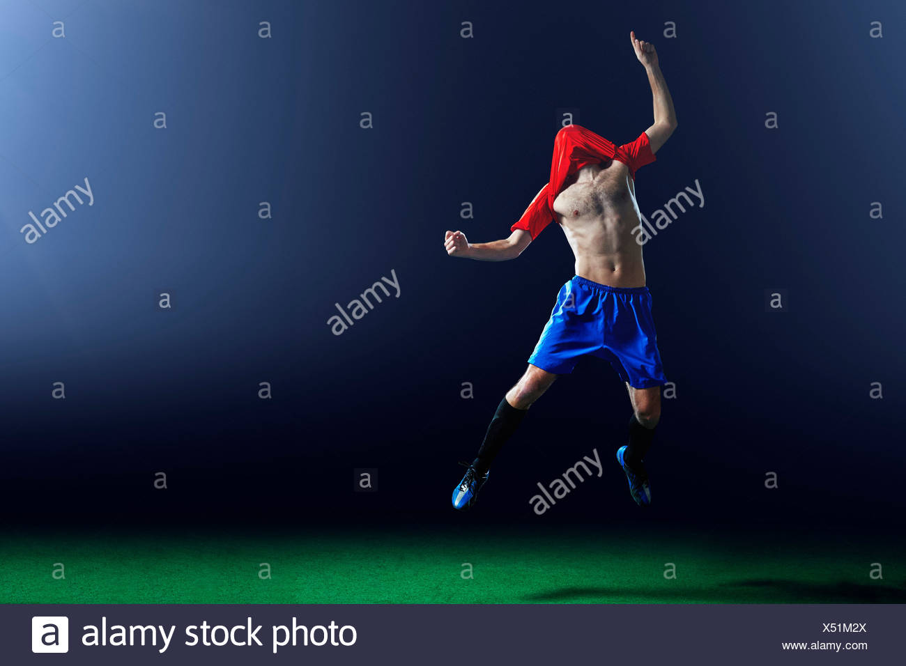 Soccer Player Shirt Over Head High Resolution Stock Photography and