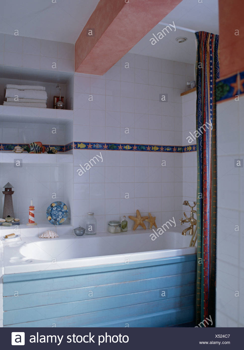 Blue Paneled Bath In White Tiled Cottage Bathroom With