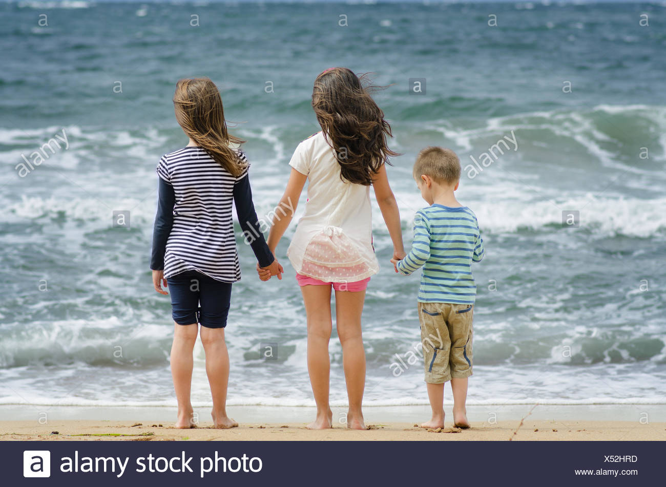 Three Girls Holding Hands High Resolution Stock Photography and Images ...