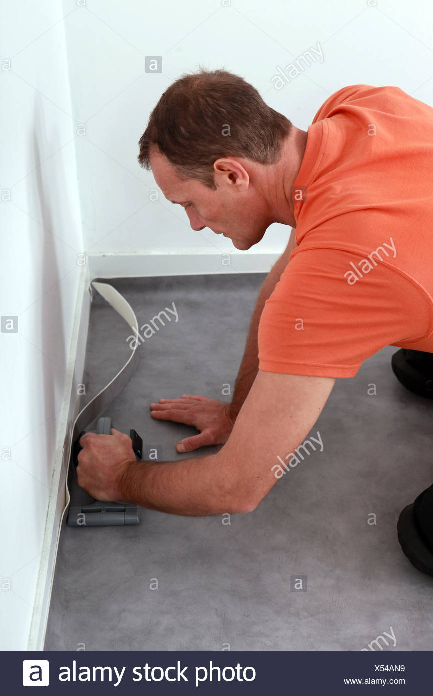 Workman Putting Down Linoleum Flooring Stock Photo 278535413 Alamy