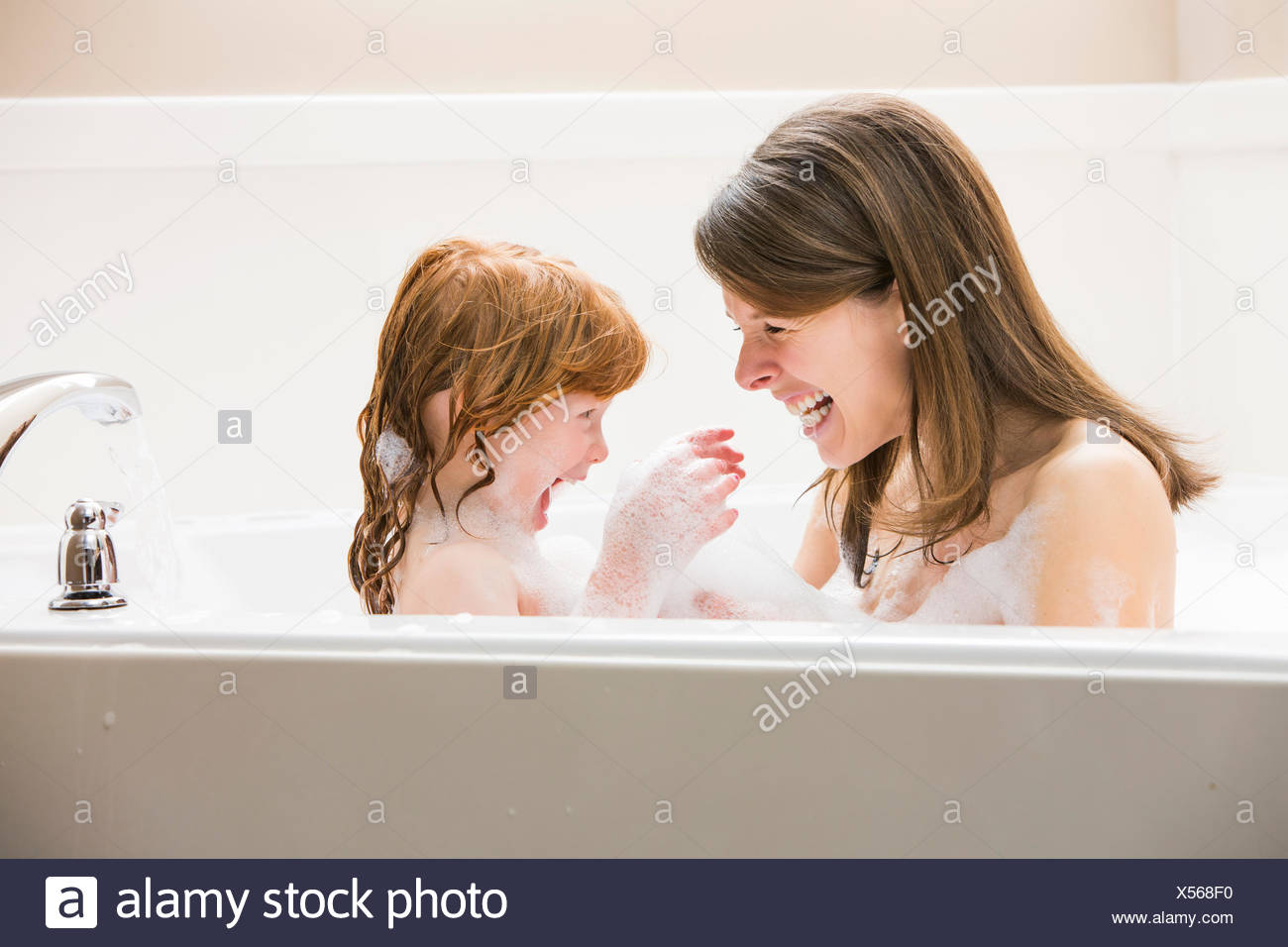 mother daughter bathing