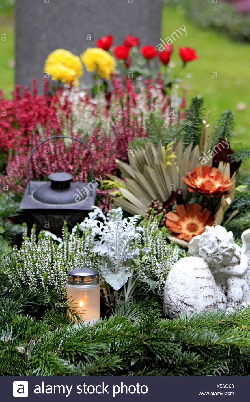 Geschmuecktes Grab auf einem Friedhof an Allerheiligen Stock Photo