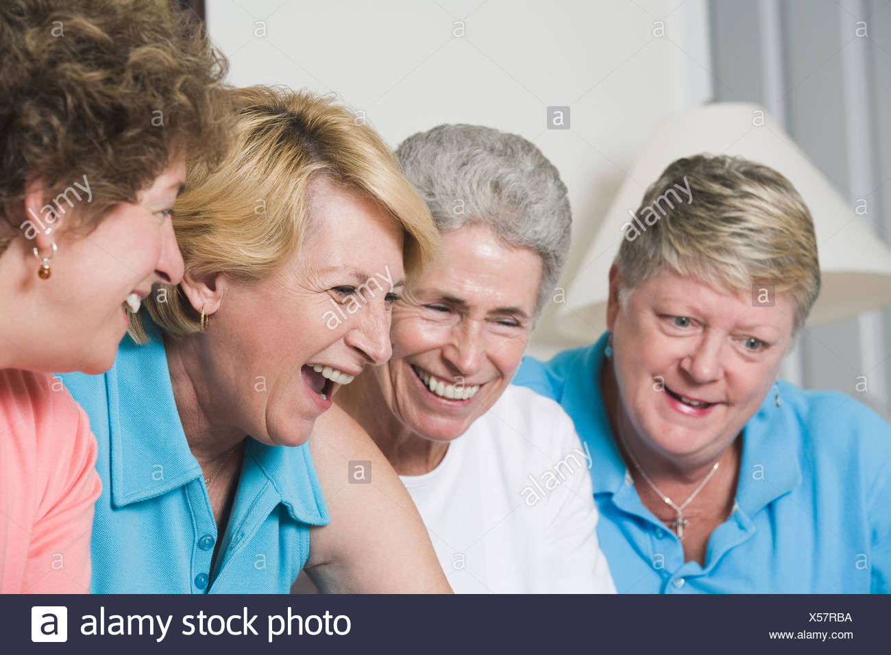four-middle-aged-women-laughing-X57RBA.jpg
