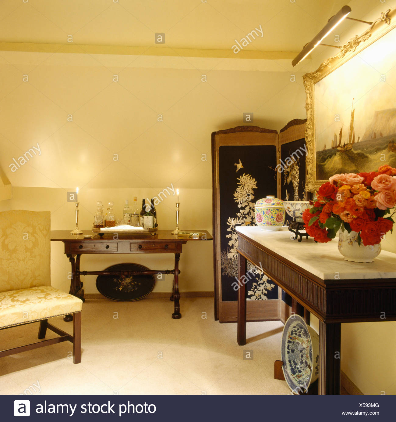 Vase Of Red Roses On Console Table In Eighties Hall With