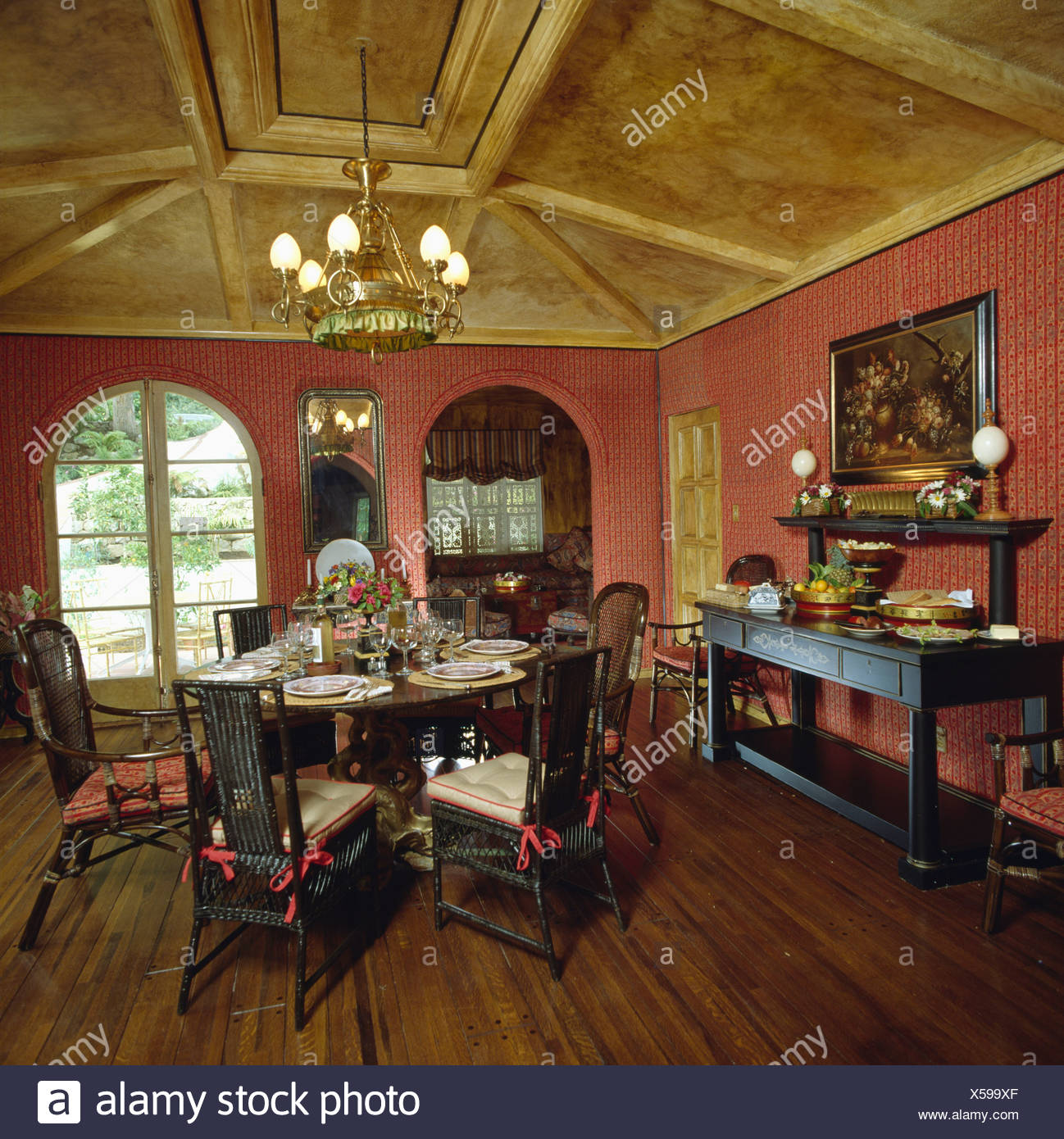 Red Eighties Diningroom With Wooden Floor And Paint Effects