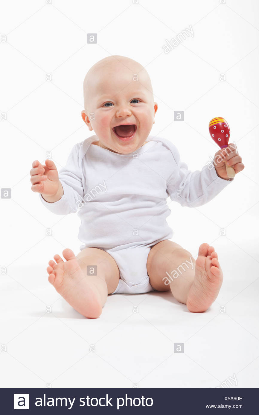 baby holding rattle