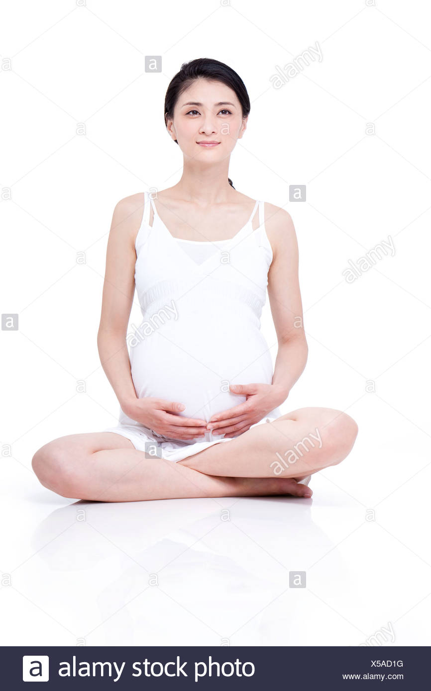 photo Sitting Cross Legged During Pregnancy https www alamy com joyful pregnant woman sitting cross legged image278668924 html