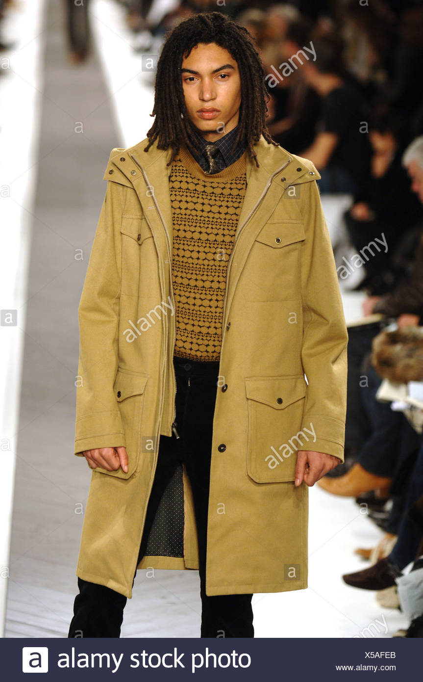 Givenchy Ready To Wear Menswear Paris A W Male Model Long Black Hair Wearing A Dark Yellow Knee Length Jacket A Tan And Black Stock Photo Alamy Givenchy Ready To Wear Menswear Paris A W Male Model Long Black Hair Wearing A Dark Yellow Knee Length Jacket A Tan And Black Stock Photo Alamy