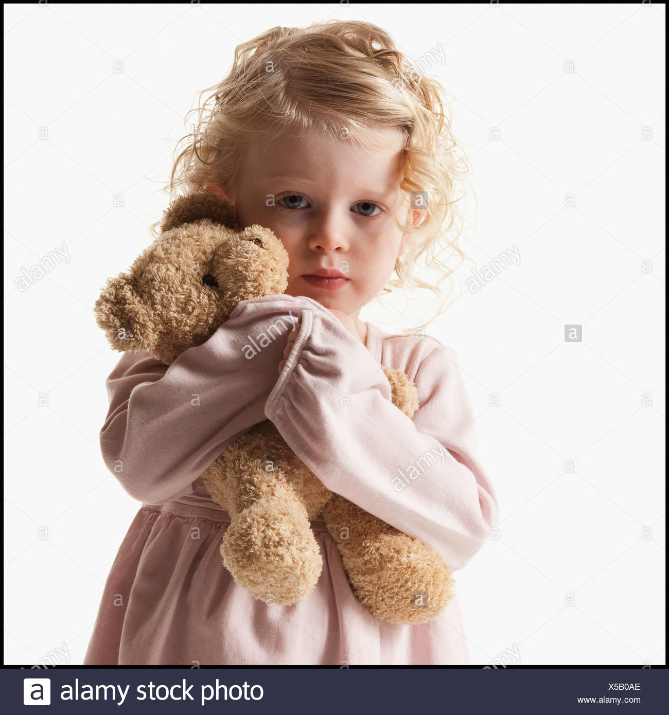 Young girl holding teddy bear Stock 