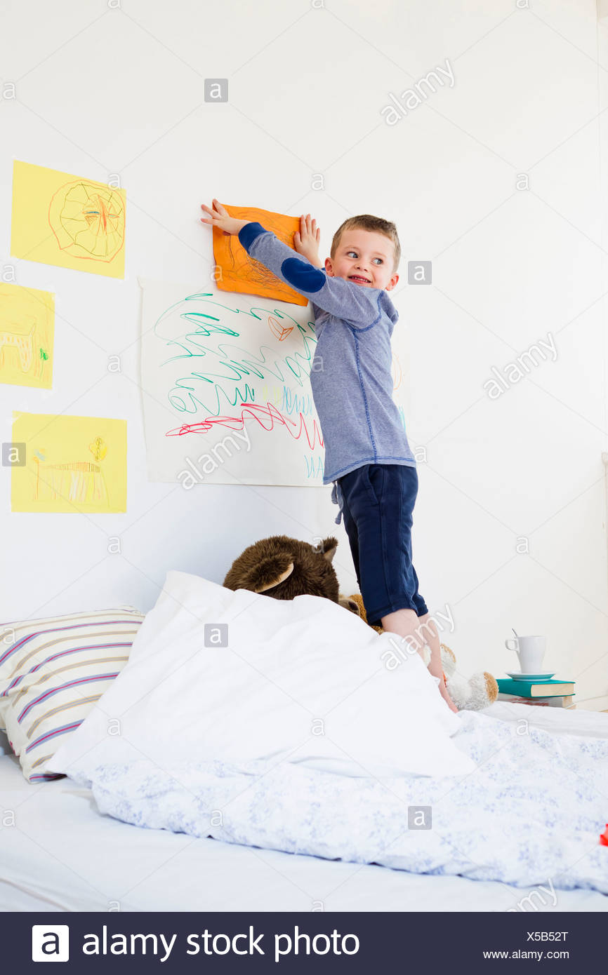 Boy Hanging Drawing On Bedroom Wall Stock Photo 278684640