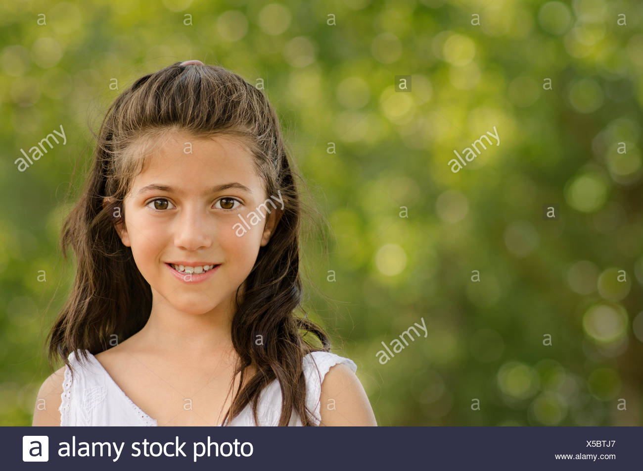 Charming little girl (8-9 Stock Photo - Alamy