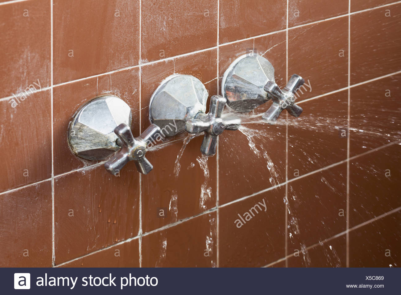 A Shower Faucet Handle Spraying Leaking Water Stock Photo Alamy