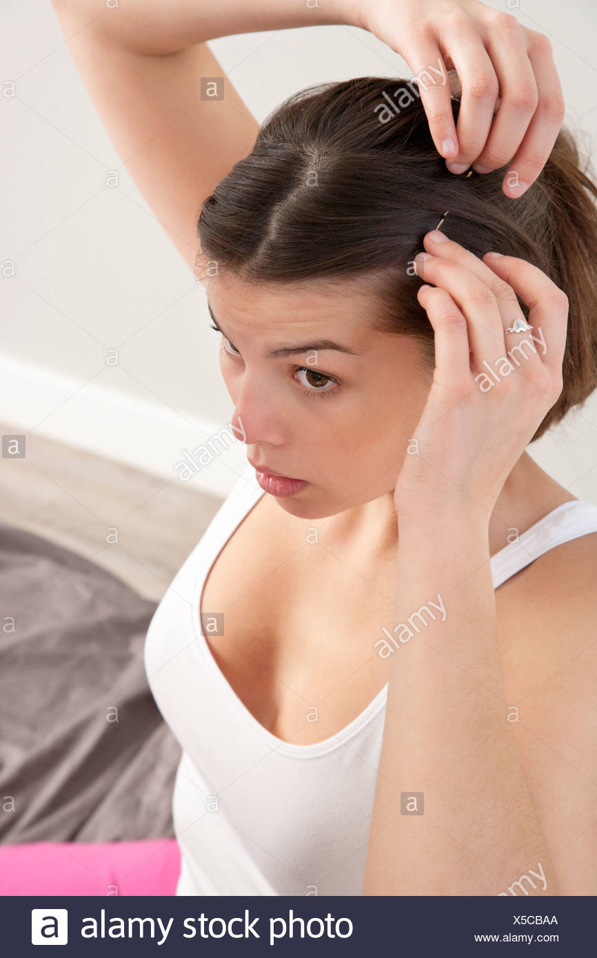Woman Pinning Hair Stock Photos Woman Pinning Hair Stock Images