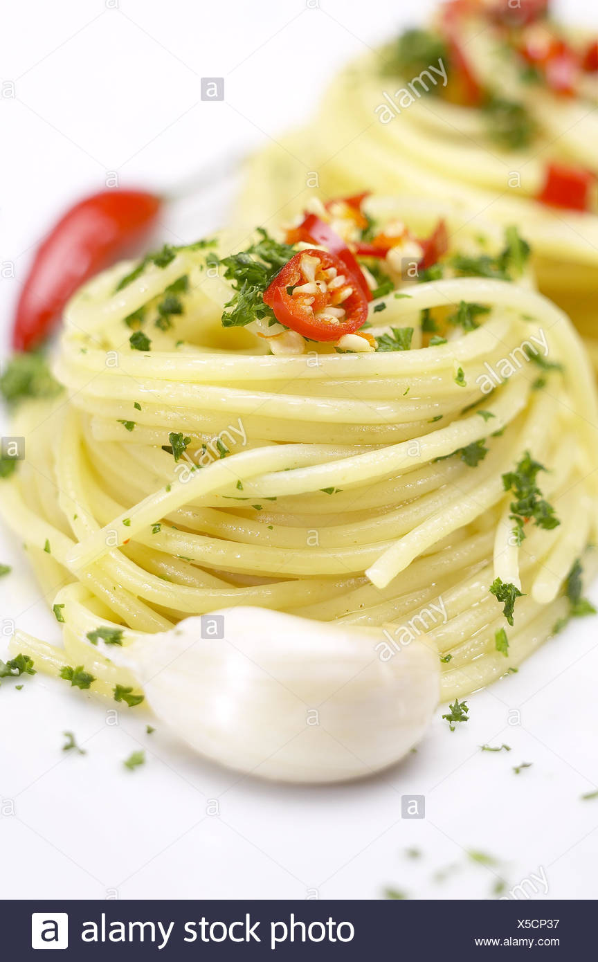 Pasta Garlic Olive Oil And Red Chili Pepper Closeup On A White Dish Stock Photo Alamy
