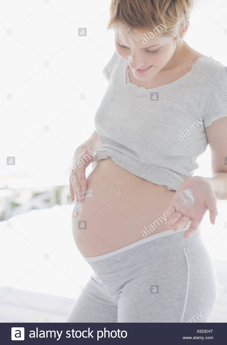 Woman Rubbing Stomach Stock Photos & Woman Rubbing Stomach Stock Images
