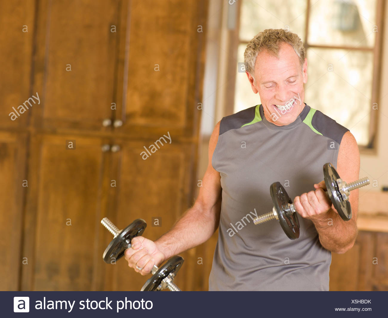 Guy Lifts Weights In Living Room