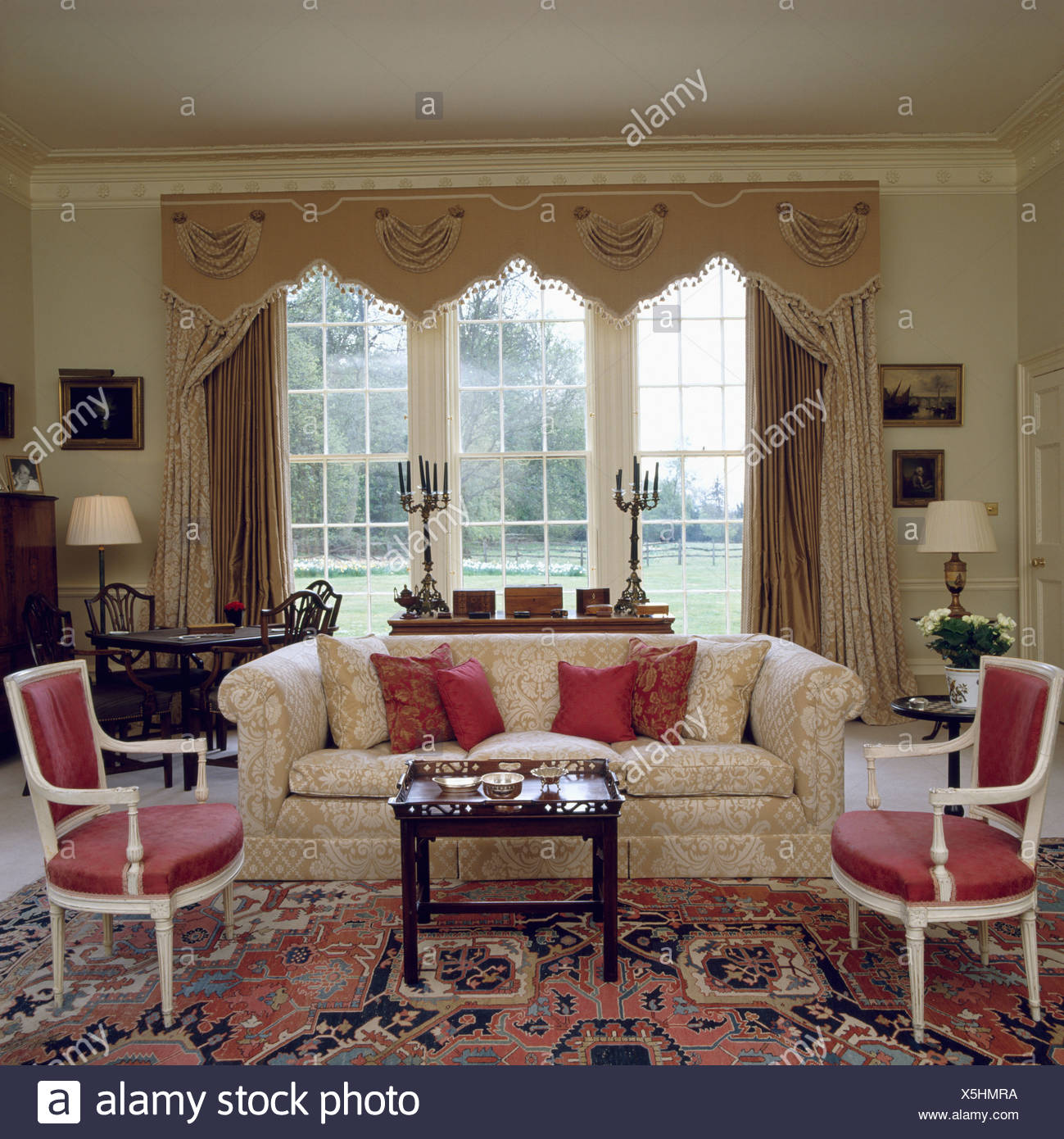 Cream Sofa In Front Of Window With Ornate Pelmet And Cream