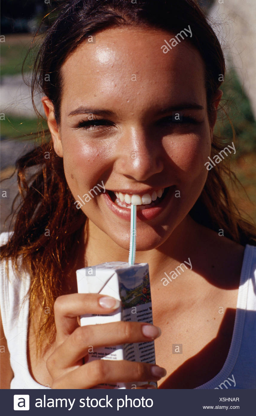Female Long Curly Brunette Hair Off Face Wearing White Vest Top