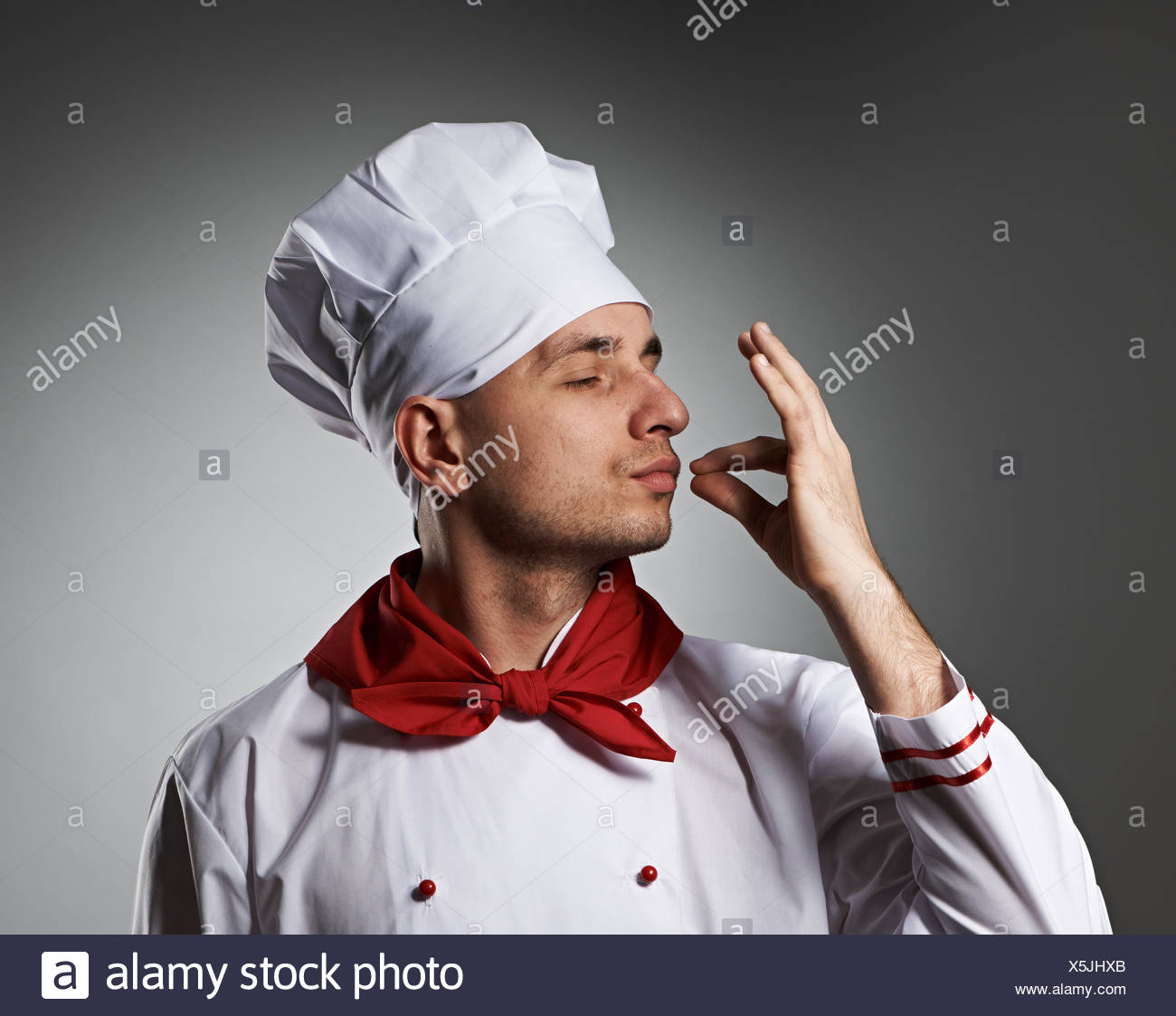 male-chef-kissing-fingers-X5JHXB.jpg