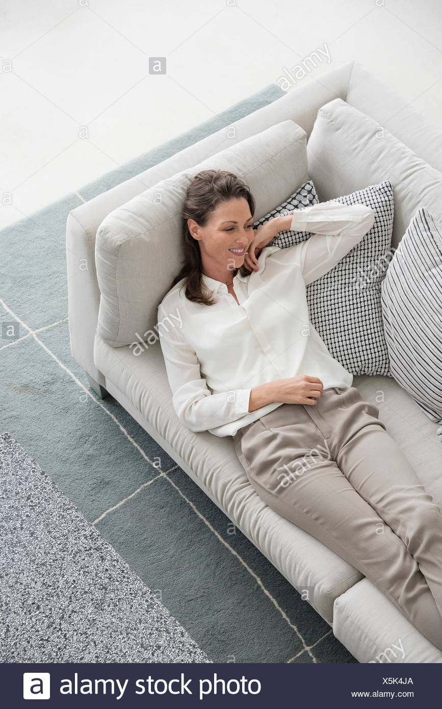 Happy Mature Woman Lying On Couch Stock Photo 278859906 Alamy